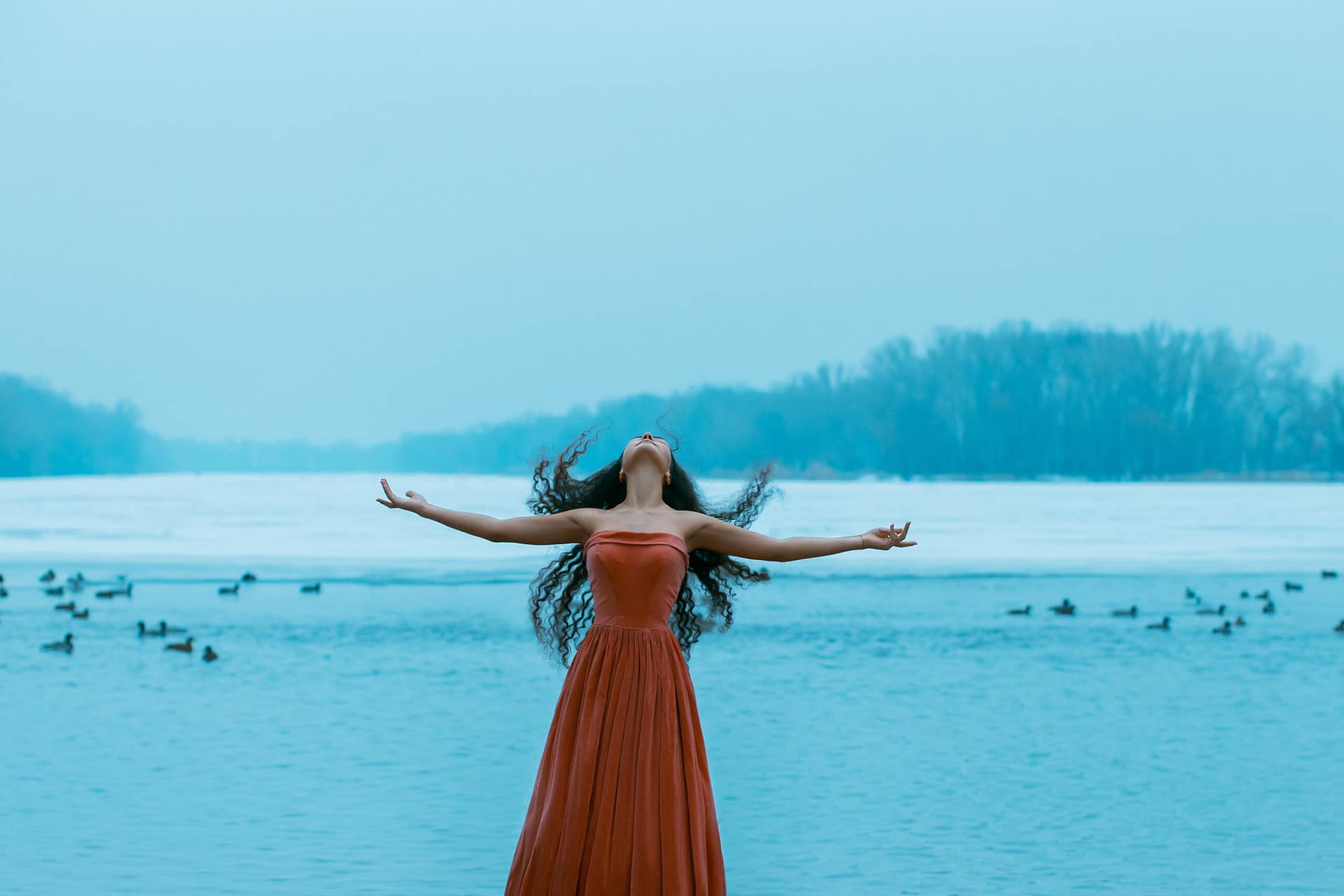 Free goddess woman at the ocean.